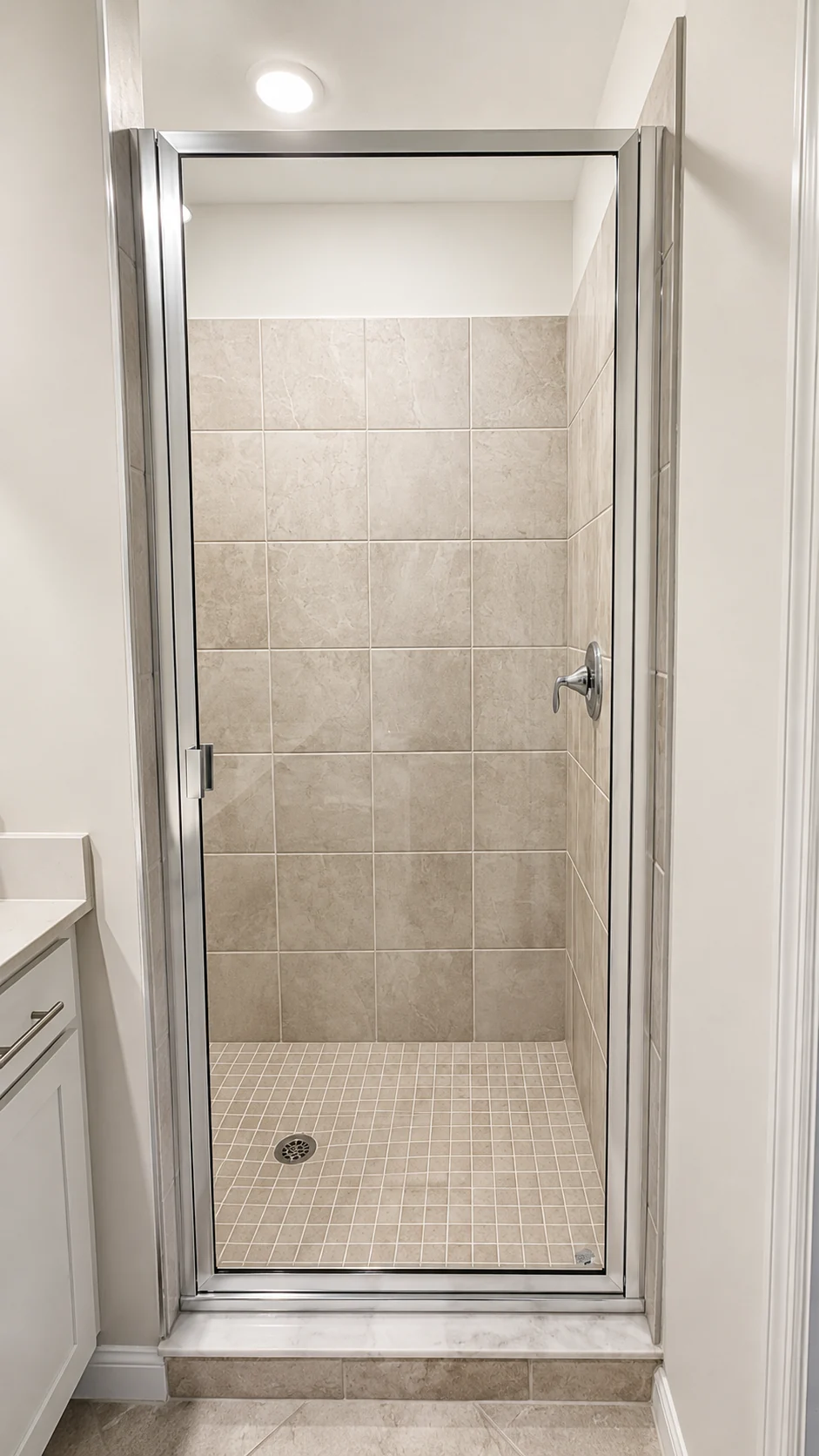 Walk-in shower detail in the primary bathroom at the Ave Maria Residence