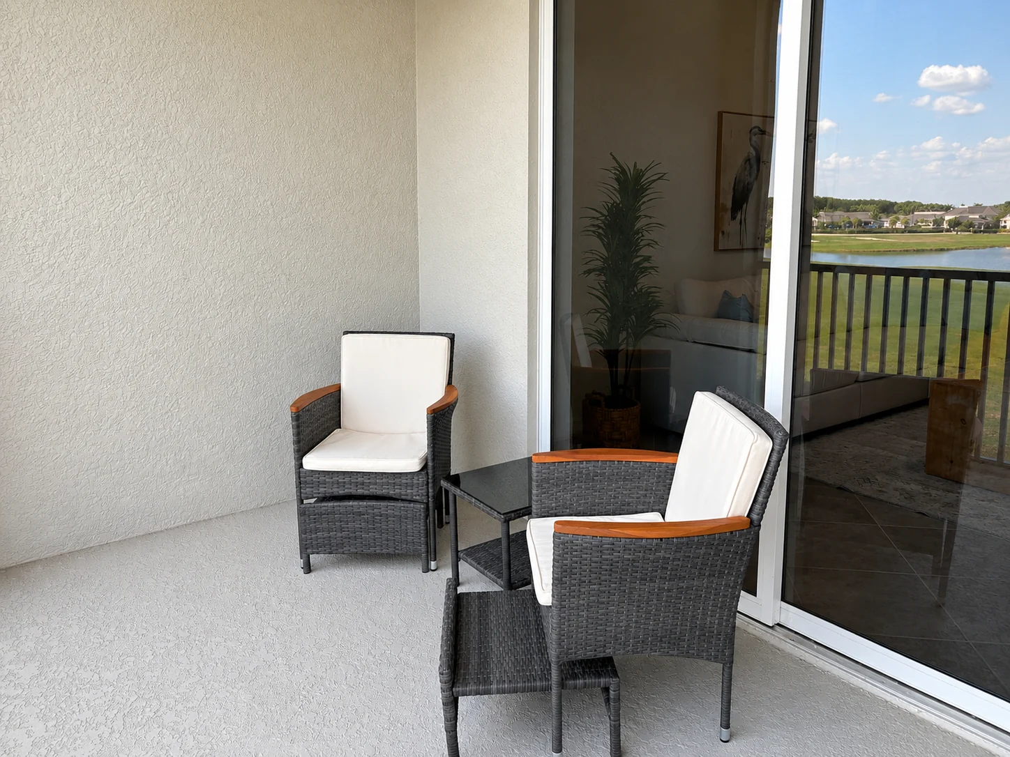 Outdoor seating on the screened terrace at the Ave Maria Residence