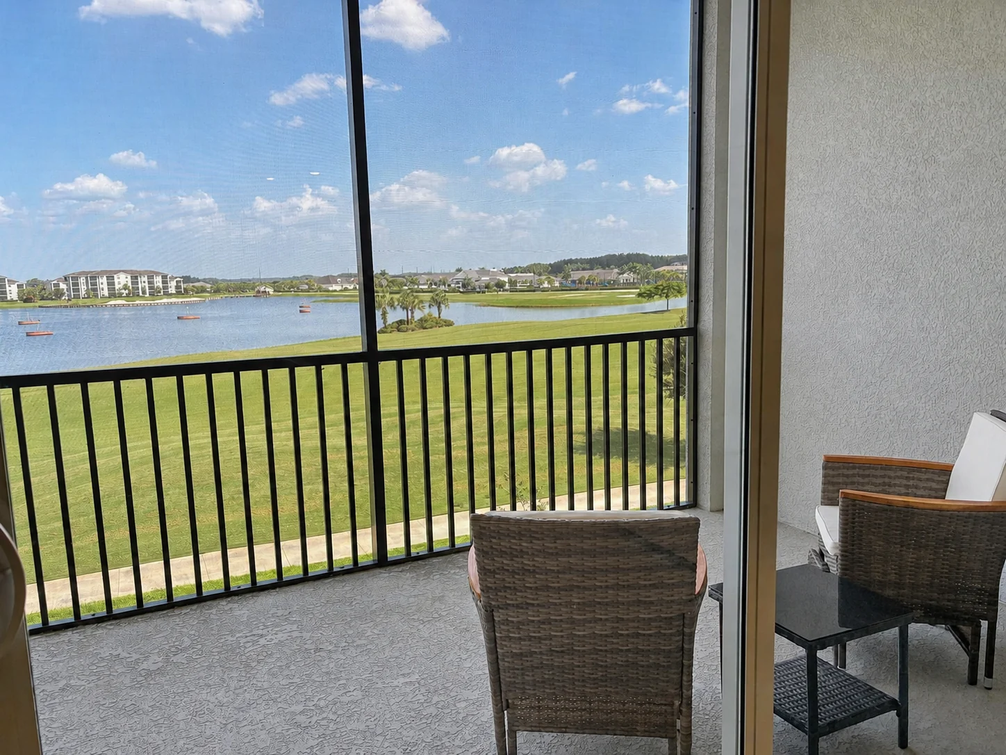 Panoramic water and landscape view from the screened terrace